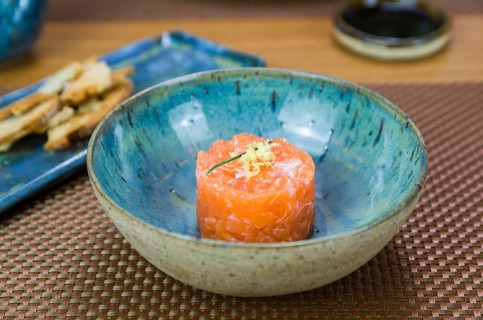 Salmon tartare deliciousness in a beautiful decorated plate