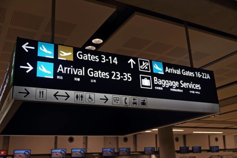 Airport signage directing passengers on international and domestic flights