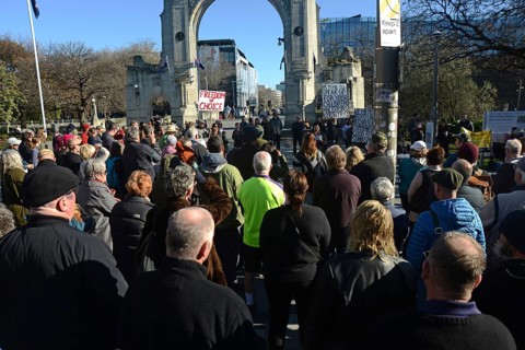 CHRISTCHURCH, NEW ZEALAND, JULY 24, 2021, People gather at a protest rally at the Bridge of