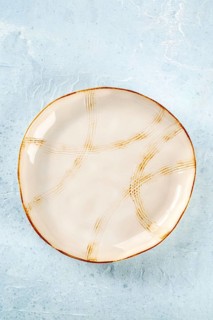 An empty plate with a gold rim, top shot on a slate background, the concept of food, Food