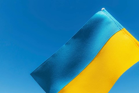 Large bicolor yellow blue Ukrainian state flag, national symbol fluttering, waving in wind against