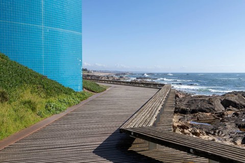 Passadiço das Ondas boardwalk, rocks and surf on the beach promenade in Nevogilde, Norte region,