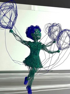 Abstract wire sculpture of a child holding balloons, rendered in blue and green, AI generated