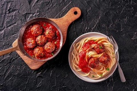 Meatballs. Beef meat balls, Italian dish, overhead flat lay shot in a pan and with a plate of