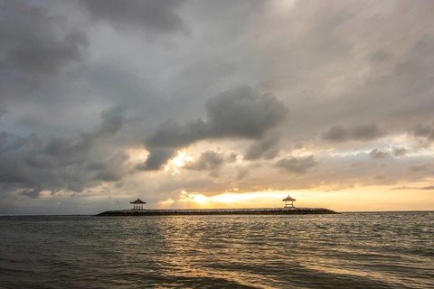 Beautiful seascape in the morning. Tropical sandy beach with breakwater and reflection of the sky