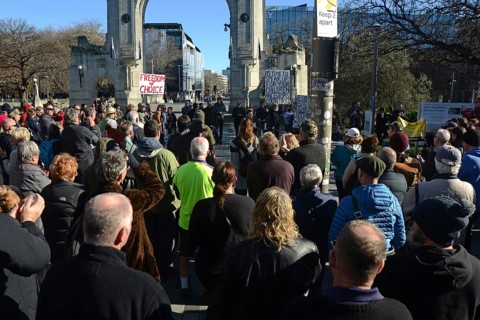 CHRISTCHURCH, NEW ZEALAND, JULY 24, 2021, People gather at a protest rally at the Bridge of