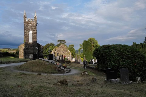 Church and graveyard in Cúil Aodha in West Cork on a sunny evening. County Cork, Ireland, Europe