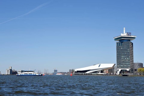 Amsterdam, Netherlands. April 2023. The river IJ with the Eye museum and a canalboat