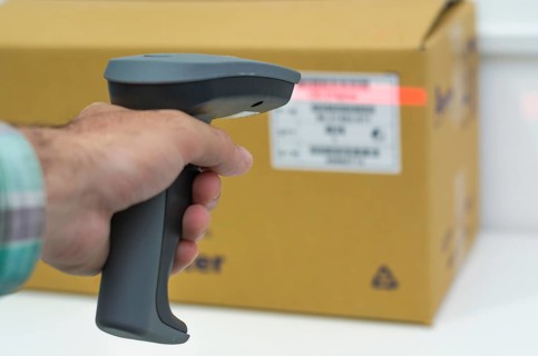 Great concept of traceability, ERP system, hand crawling product barcode and packaging. The man