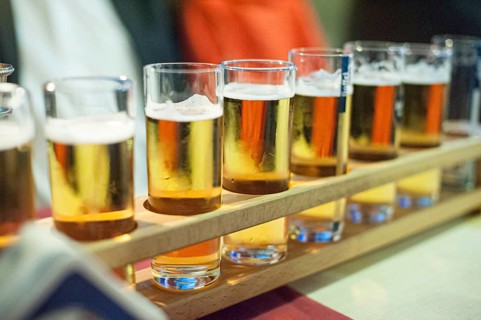Long row of beer in tall glasses
