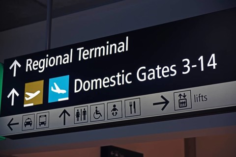 Airport signage directing passengers on regional and domestic flights