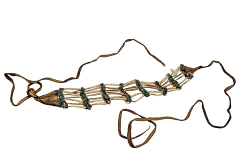 Indian necklace made from shells, turquoises and leather strips on a white background