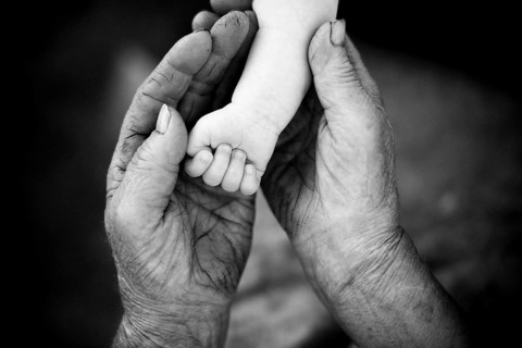 Youth and old age. Hands of grandmother and granddaughter.