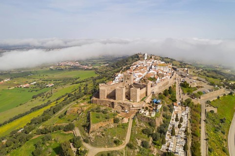Monsaraz drone aerial view on the clouds in Alentejo, Portugal, Europe