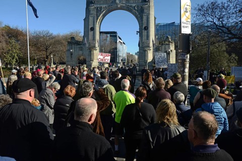 CHRISTCHURCH, NEW ZEALAND, JULY 24, 2021, People gather at a protest rally at the Bridge of