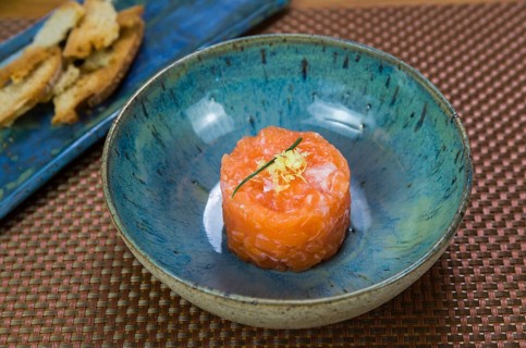 Salmon tartare deliciousness in a beautiful decorated plate