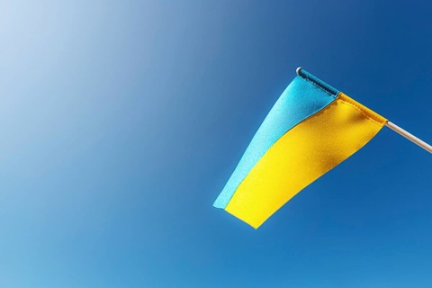 Large bicolor yellow blue Ukrainian state flag, national symbol fluttering, waving in wind against