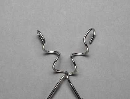 Two kneading hooks on grey background