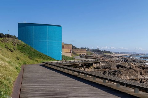 Passadiço das Ondas boardwalk, rocks and surf on the beach promenade in Nevogilde, Norte region,