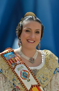 Fallas festival, woman in a traditional costume during the parade in the Plaza de la Virgen de los