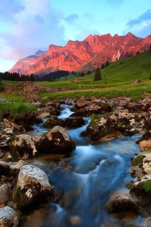 Mountain stream, evening light, alpenglow, Alpstein massif with Säntis, Appenzell, Switzerland,