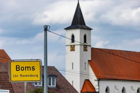 Place-name sign of Boms in the district of Ravensburg with church, Boms, Baden-Württemberg,