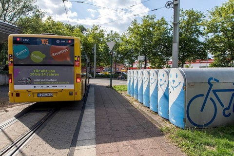 Bicycle boxes at a bus and tram stop in Essen, commuters can rent the boxes and park their bikes