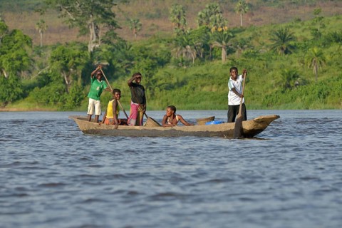 Fisher family on a pirogue on the Congo River, near Tshumbiri, Bandundu Province, Congo, Africa