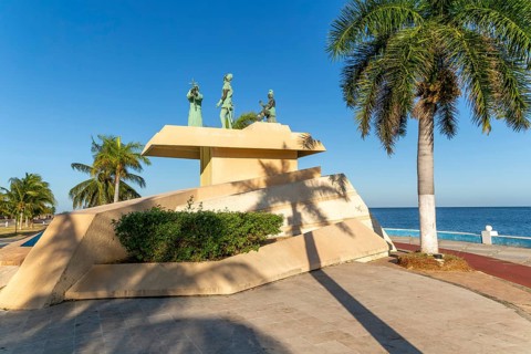 Artwork sculpture of priest with Spanish soldier and Mayan person, Malecon, Campeche city, Campeche