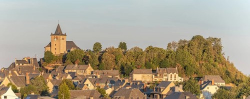 Small Saint-Matthieu church on hill of village of Laguiole. Panorama. Aubrac, France, Europe