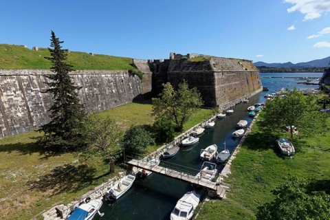 Old Venetian fortress, Martinengo bastion and moat with fishing boats, Corfu Town, Kerkira or