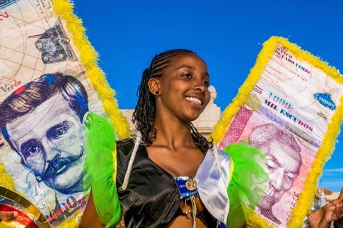 Colourful costumed, pretty women are dancing. Carnival. Mindelo. Cabo Verde. Africa