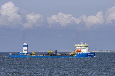 Trailing suction hopper dredger, TSHD Krakesandt sailing the Western Scheldt, Westerschelde along