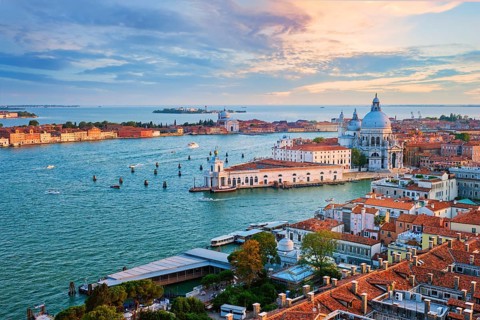 Aerial view of Venice lagoon and Santa Maria della Salute church on sunset. Venice, Italy, Europe