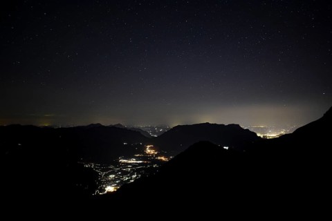 Night view of Berchtesgaden (centre) and Salzburg (right) with the Untersberg in between, seen from