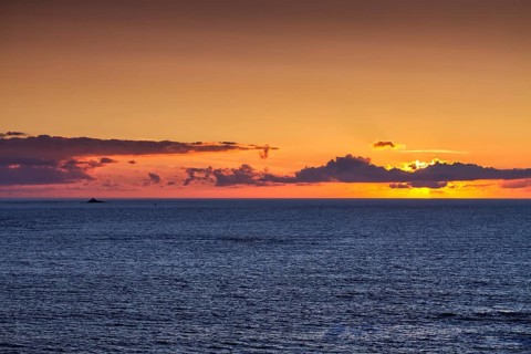 Sunset behind clouds on the Atlantic Ocean, Pointe du Van, Cap Sizun Peninsula, Département