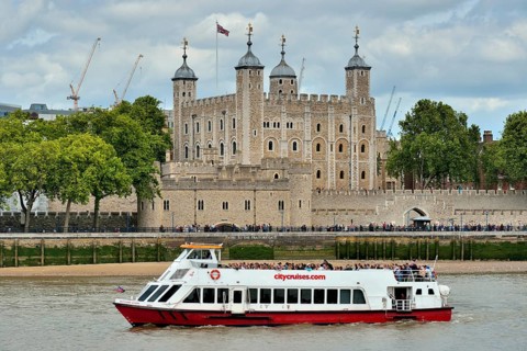 Sightseeing boat on the Thames in front of the Tower of London, London, England, United Kingdom,