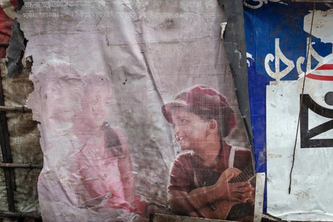 Detail of a makeshift dwelling made of plastic sheeting and bamboo sticks, Tejgaon Slum Area,