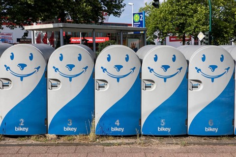 Bicycle boxes at a bus and tram stop in Essen, commuters can rent the boxes and park their bikes