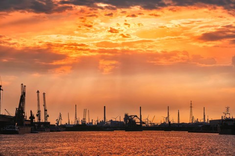 Port of Antwerp crane silhouettes on sunset. Antwerp, Belgium, Europe