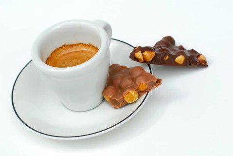 Cup with espresso and hazelnut chocolate