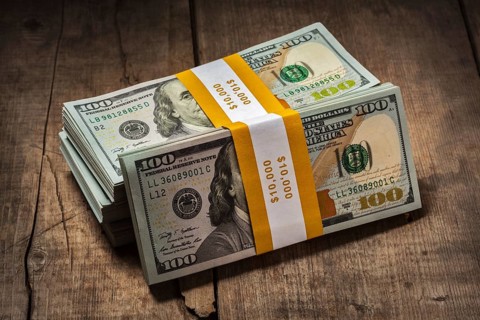 Creative business finance making money concept, stacks of new 100 US dollars 2013 edition banknotes