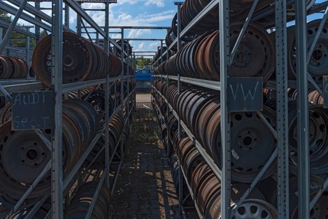 Shelf storage with sorted car rims at a scrap yard, Bavaria, Germany, Europe