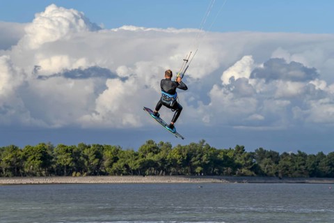 Kite surfing in the air, Grado Pineta beach, Lagoon di Grado, Friuli Venezia Giulia region, Italy,