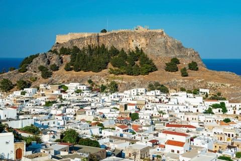 Town of Lindos with white houses, Acropolis of Lindos in the back, Lindos, Rhodes, Dodecanese,