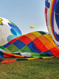 Hot air balloons on the ground, preparation for mass launch, Hot Air Balloon Festival, Warsteiner