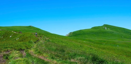 Hikers in the Monts Dore mountains in Auvergne Volcanoes Natural Park, Sancy Massif, Puy de Dome