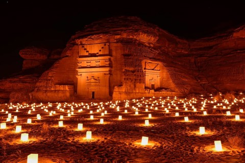 Illuminated Nabataean tombs at night, Hegra or Mada'in Salih, AlUla region, Medina province, Saudi