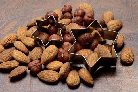 Nuts and cookie cutters, almonds and hazelnuts