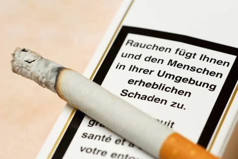 Burning cigarette and warning on pack, cigarette pack, smoking, warning, cigarettes